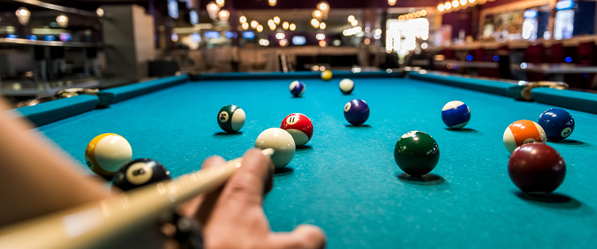Low view of a pool table.